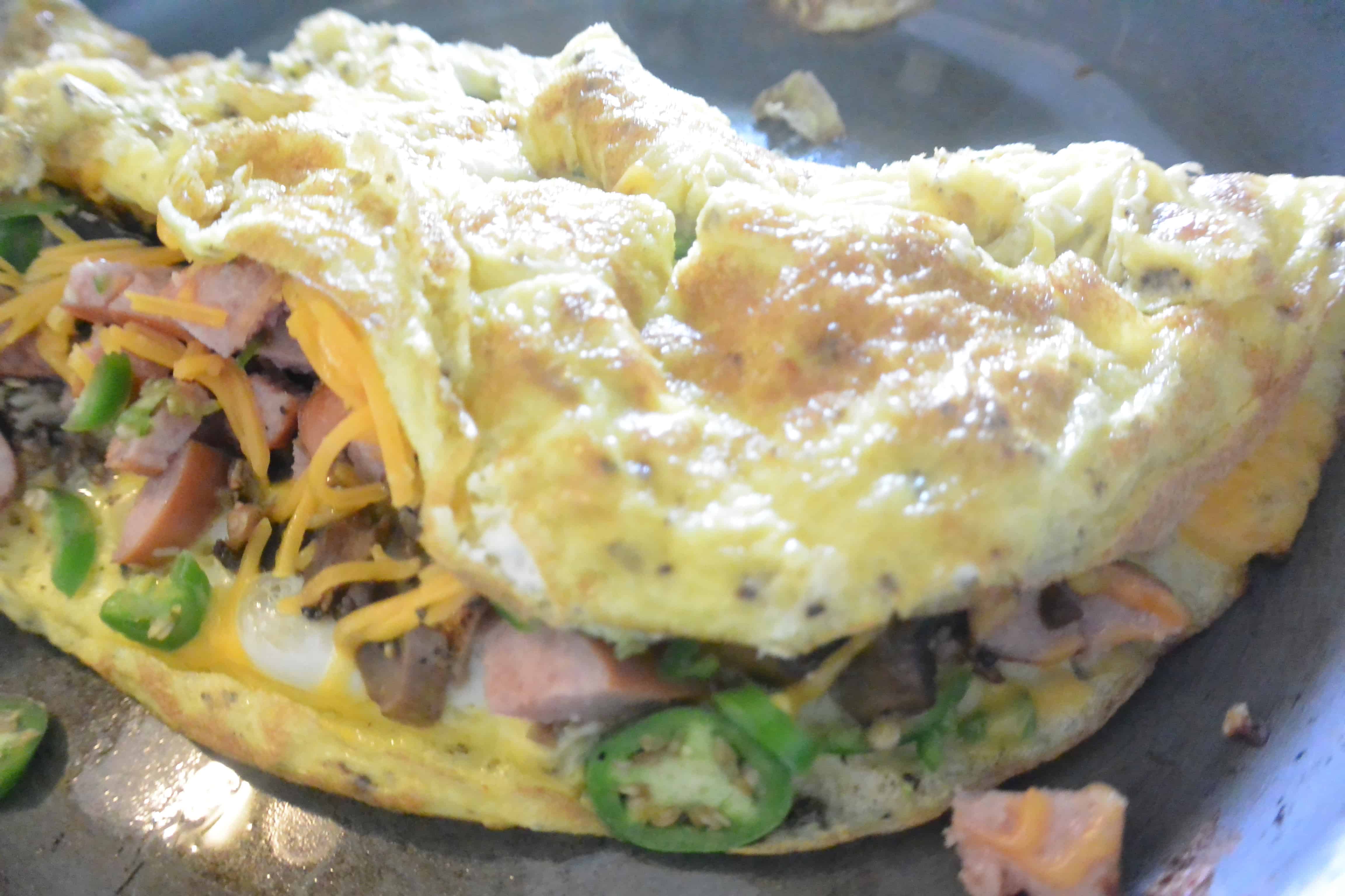 An omelet with ham, peppers and cheese
