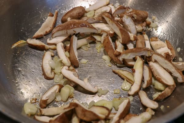 sliced mushrooms in pan