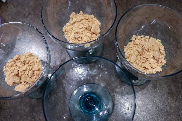 Crushed up graham crackers in a glass