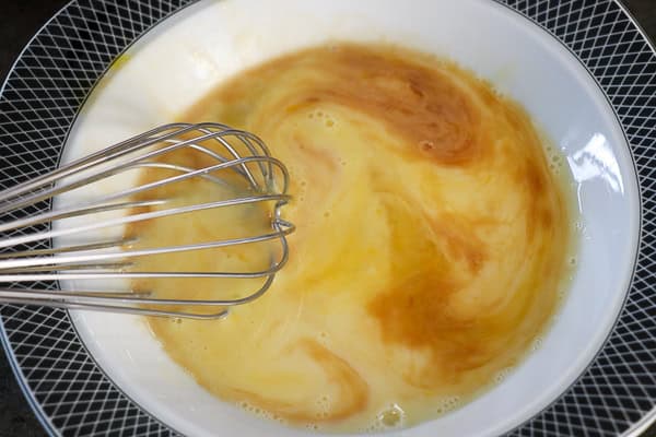 Eggs with a whisk and vanilla