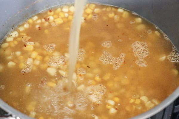 Broth poured into corn soup 