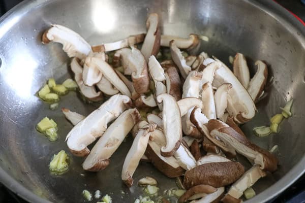 Sliced mushrooms in pan