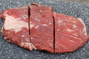 A piece of meat is cut into four pieces