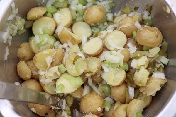 A bowl filled with potatoes and onions