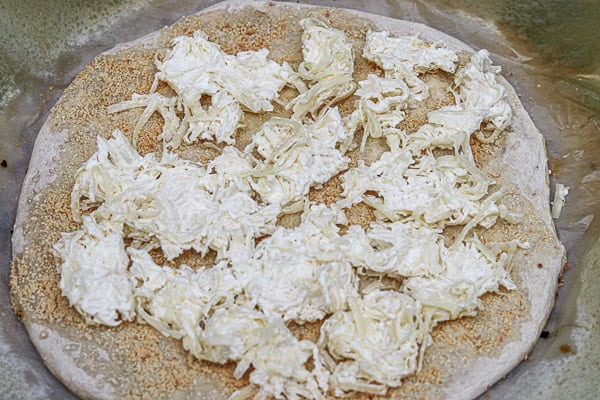 A pizza with cheese on top