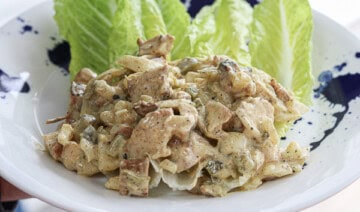 A plate with lettuce and chicken salad