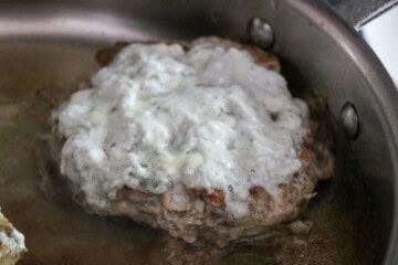 Turkey buger with cheese in a pan