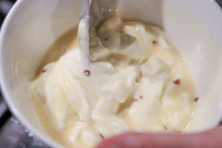 Mixing sauce with spoon