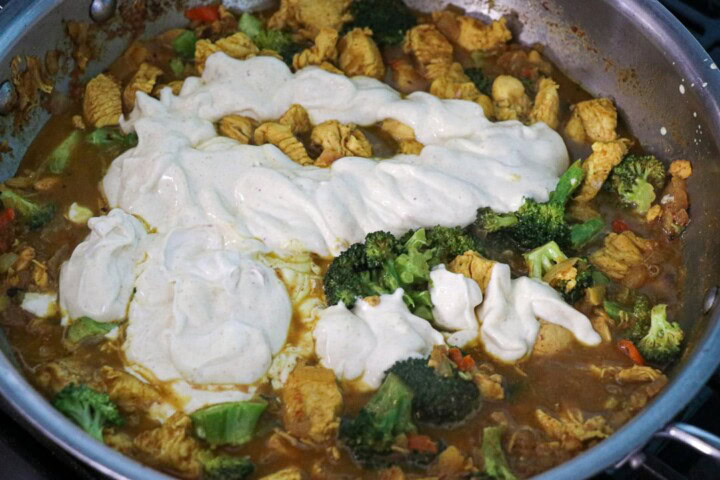 Yogurt sauce added to chicken and broccoli