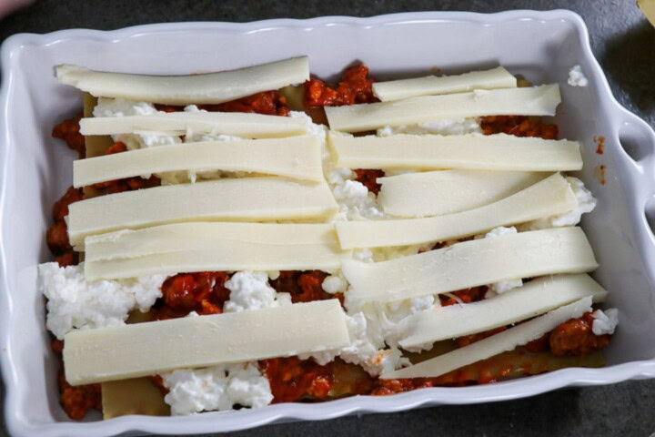 Cheese added to top of sauce and cottage cheese