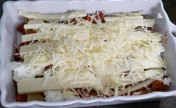 Cheese on top of sauce for lasagna