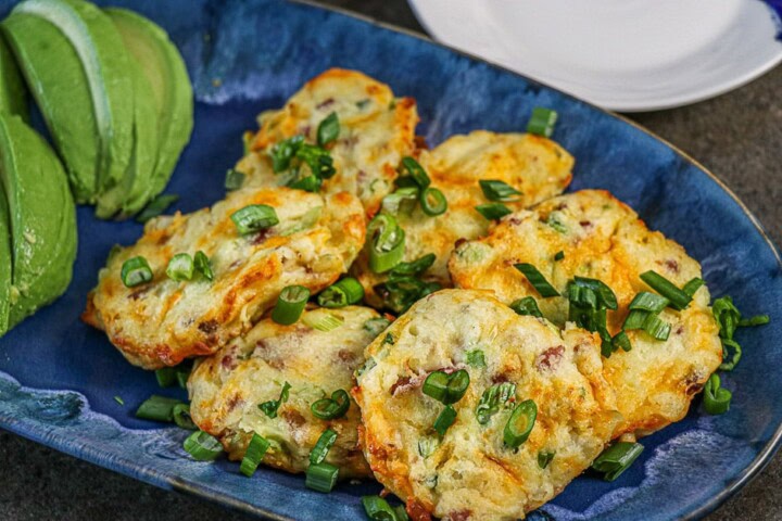 Air Fryer Bacon Cheddar Potato Cakes on a blue plate