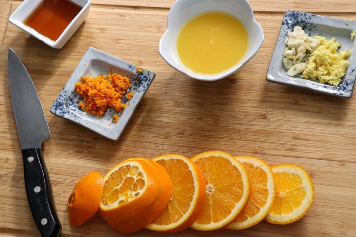 Sliced oranges, zest and juice