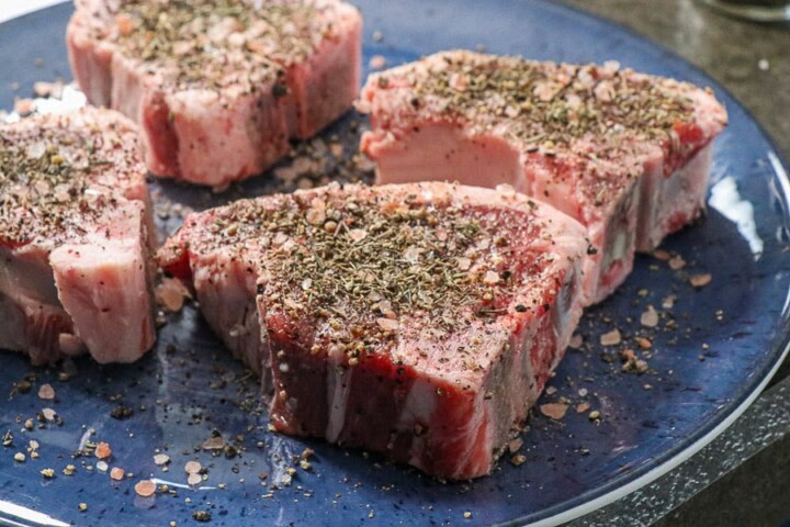 Lamb Chops with salt and pepper in a pan