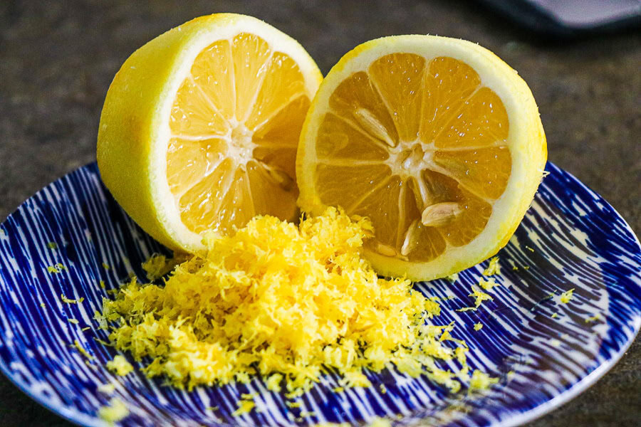 Lemon and Lemon zest on blue plate