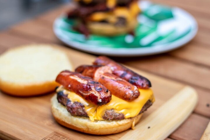Hot dog on top of cheeseburger
