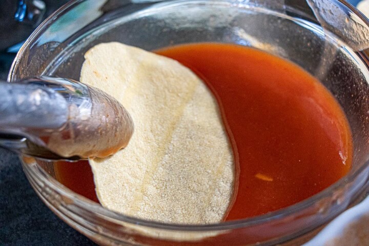 Tortilla chips dipped in sauce
