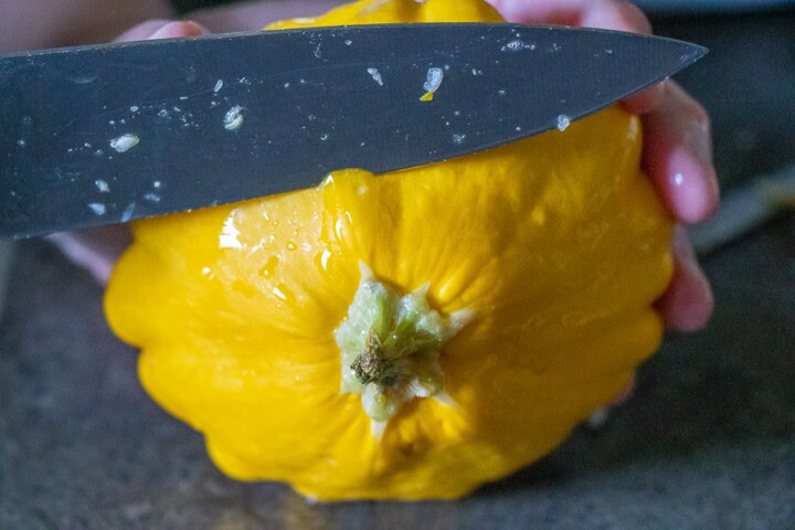 Cutting the top of a patty pan squash
