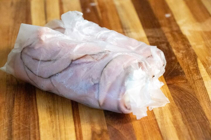 Ham wrapped in saran wrap.