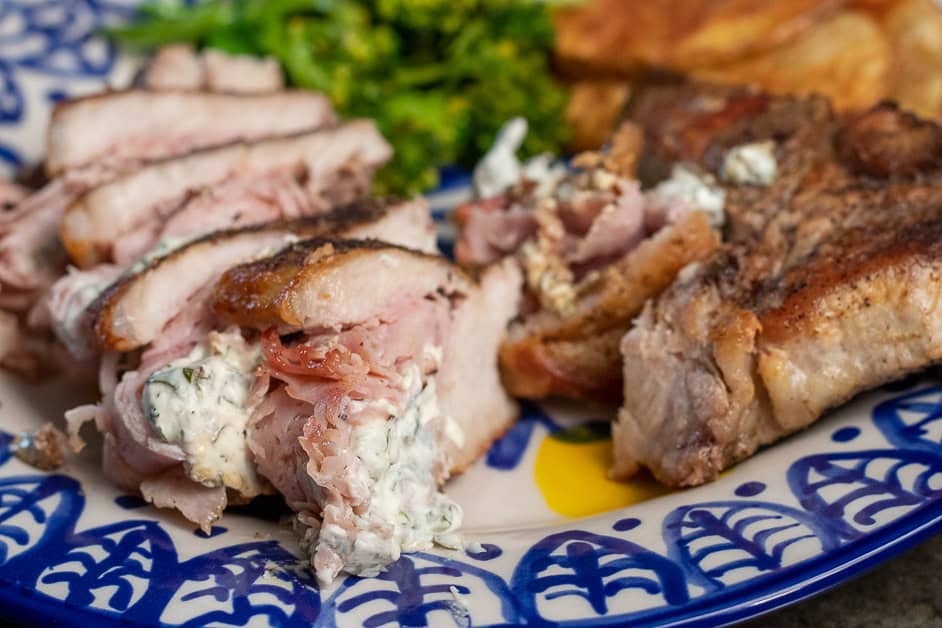 Sliced stuffed pork chop on a plate