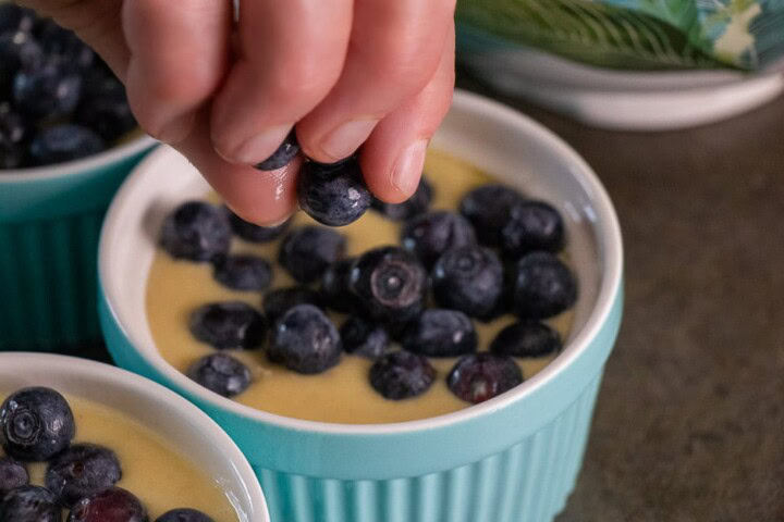 Blueberries placed in cake batter