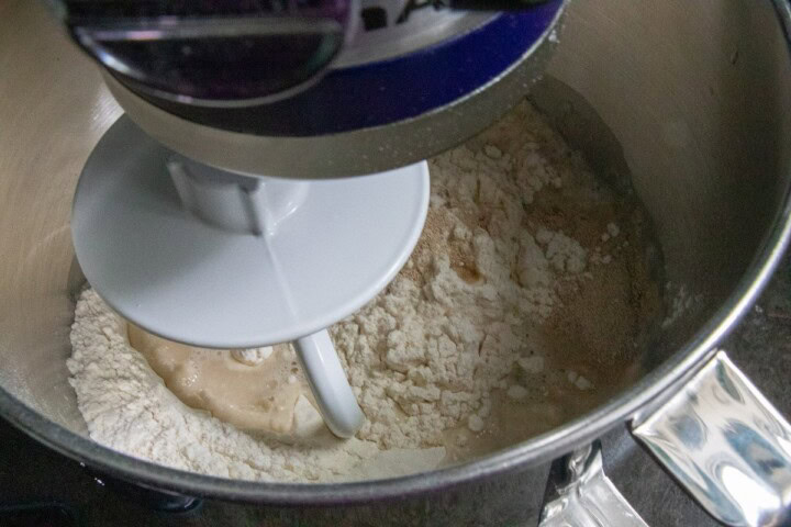 Bagel dough in a mixing bowl with a dough hook