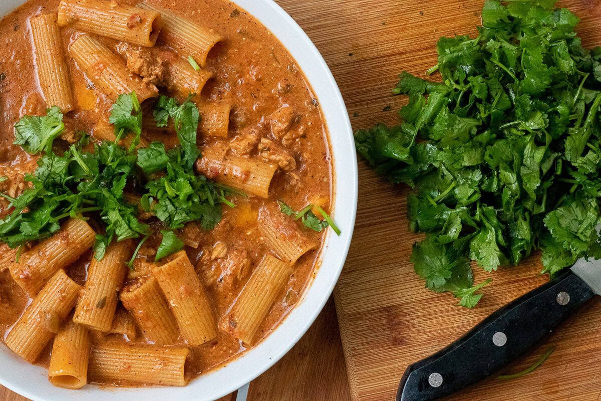 Pasta with taco sauce and cilantro
