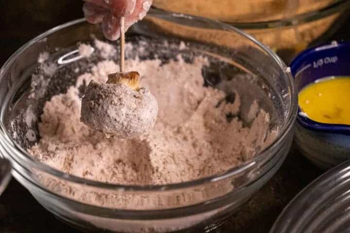 dip the mushroom in the flour