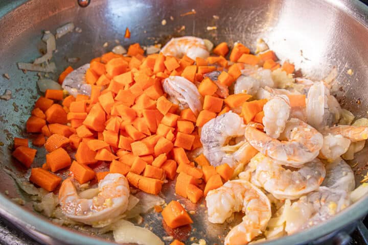 Carrots and shrimp in a pan