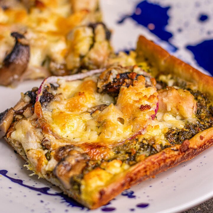 Slice of chicken pesto pizza