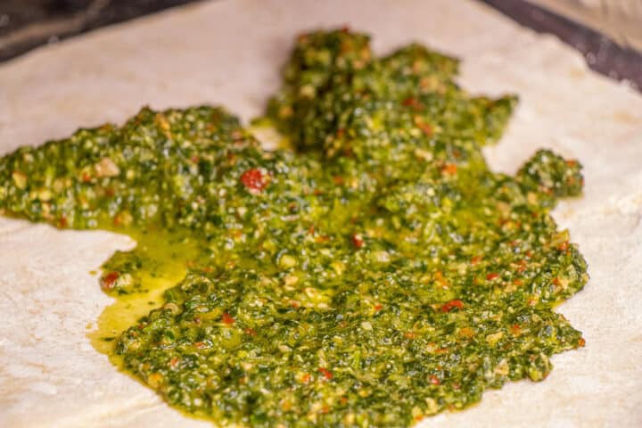 Pesto on pizza crust