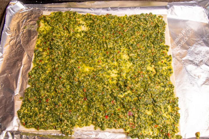 Pesto on pizza crust