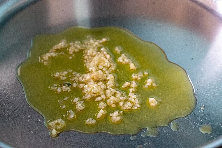 Olive oil with garlic in a pan