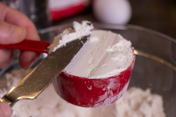 Pouring flour into a bowl