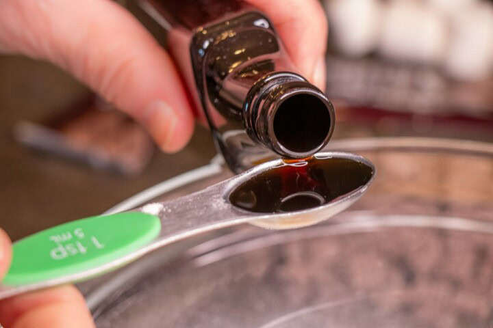 Pouring liquid into a glass bowl