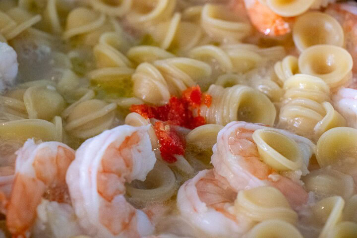 Shrimp and pasta in a pan
