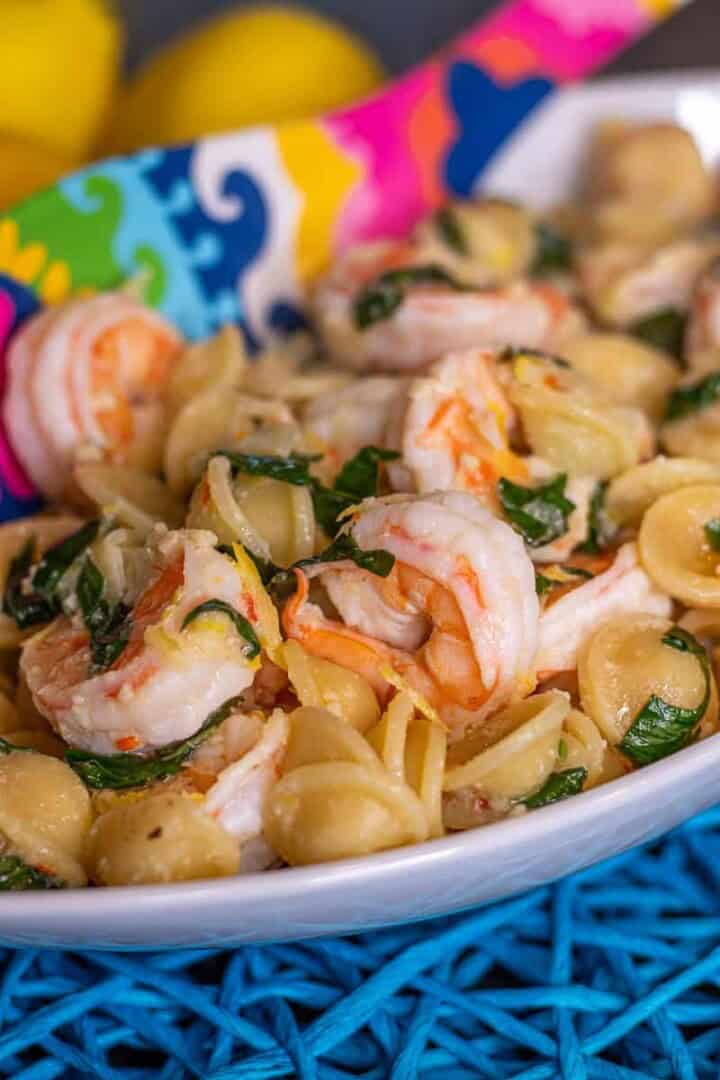 Shrimp, basil and pasta in a bowl