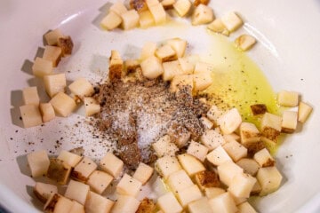 Cut up potatoes with olive oil, salt, pepper and garlic in a sauce pan