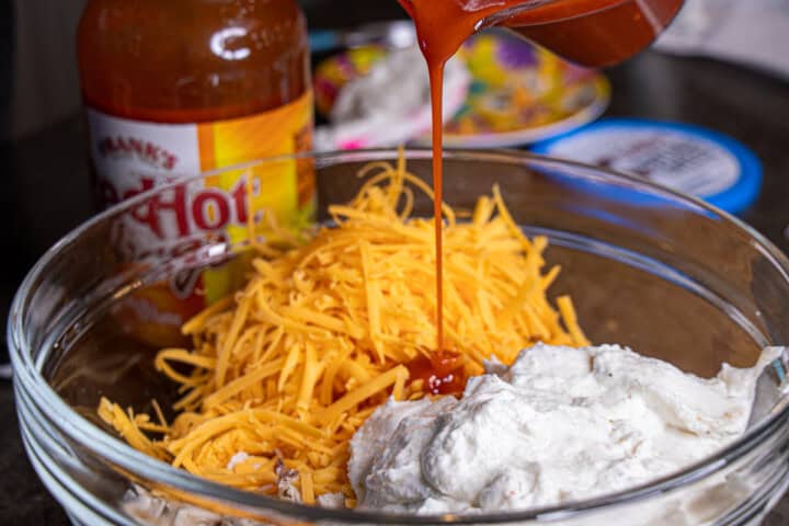 Cottage Cheese, Cheddar cheese, Franks hots sauce, chicken in a bowl