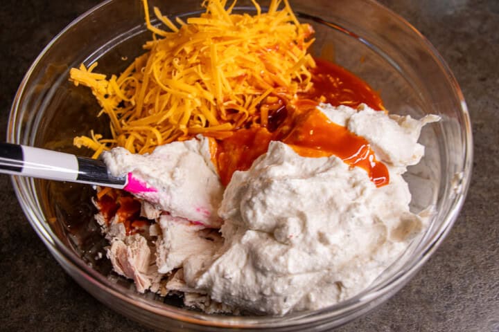 Cottage Cheese, Cheddar cheese, Franks hots sauce, chicken in a bowl