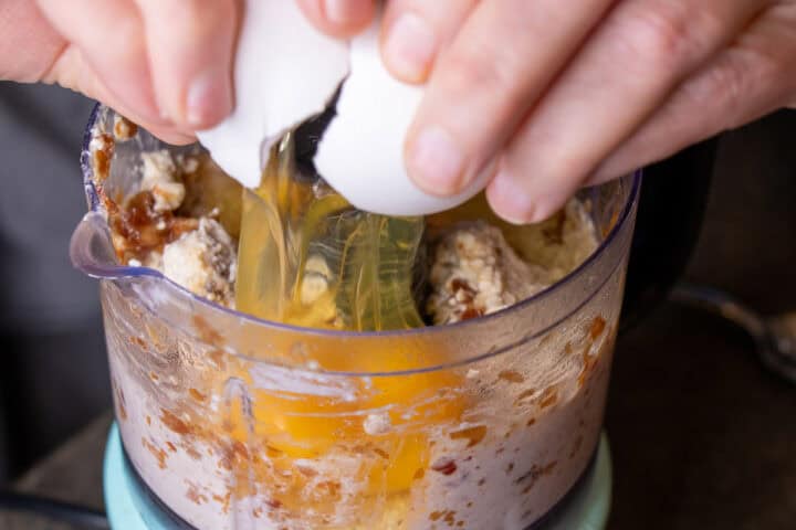 Eggs cracked into food processor