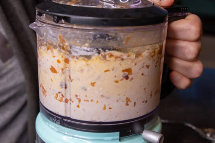 Food processor with eggs, cottage cheese, dates blended