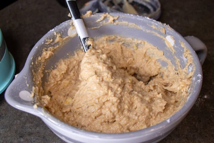 Banana bread in a bowl with a spoon