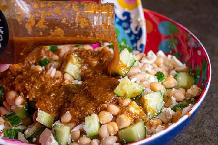 Adding ginger dressing to the bean cucumber salad