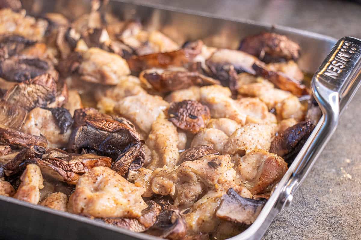 Cooked Chicken and mushrooms in a roasting pan