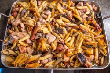 Baked Chicken, mushrooms, pasta and sauce in roasting pan