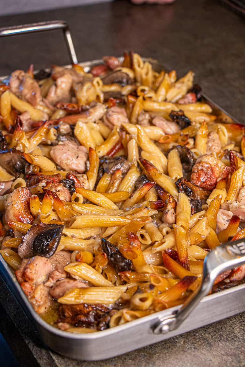 Baked Chicken, mushrooms, pasta and sauce in roasting pan