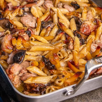 Pasta, mushrooms and chicken in pan