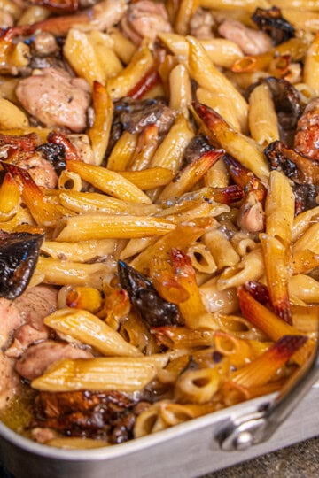 Pasta, mushrooms and chicken in pan